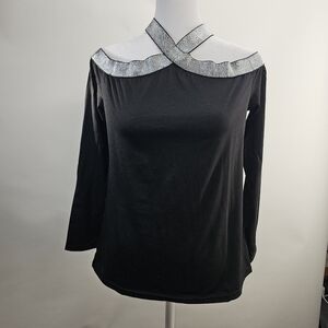 Black cold shoulder top with silver band on neck and shoulders